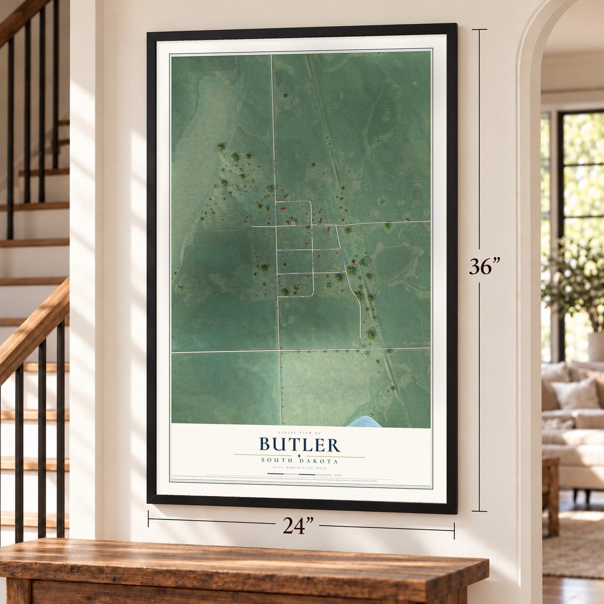 Butler, South Dakota map, 24 x 36 inch print in a black frame by a staircase