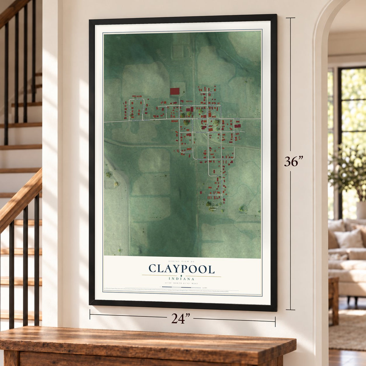 Claypool, Indiana map, 24 x 36 inch print in a black frame by a staircase