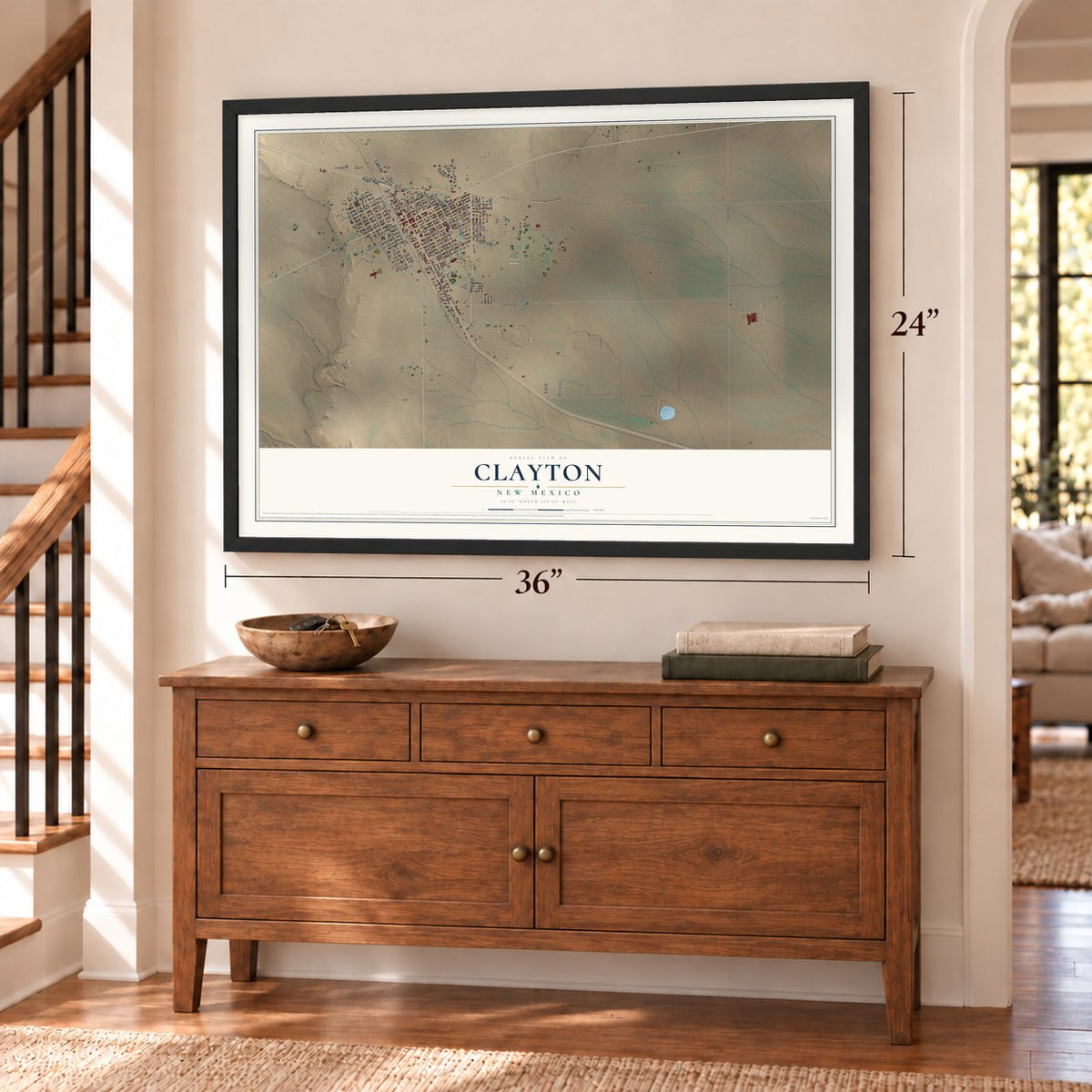 Clayton, New Mexico map, 24 x 36 inch print in a black frame above a dresser by a staircase
