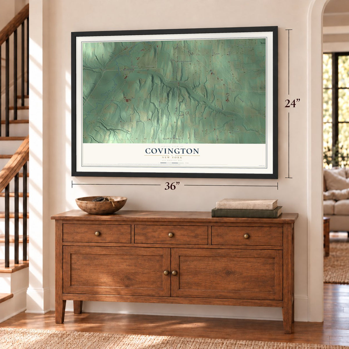 Covington, New York map, 24 x 36 inch print in a black frame above a dresser by a staircase