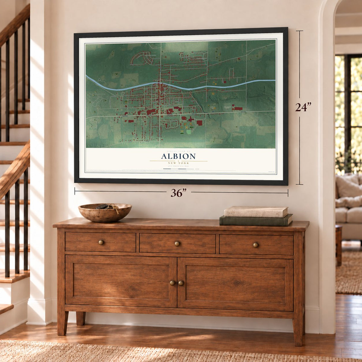Albion, New York map, 24 x 36 inch print in a black frame above a dresser by a staircase