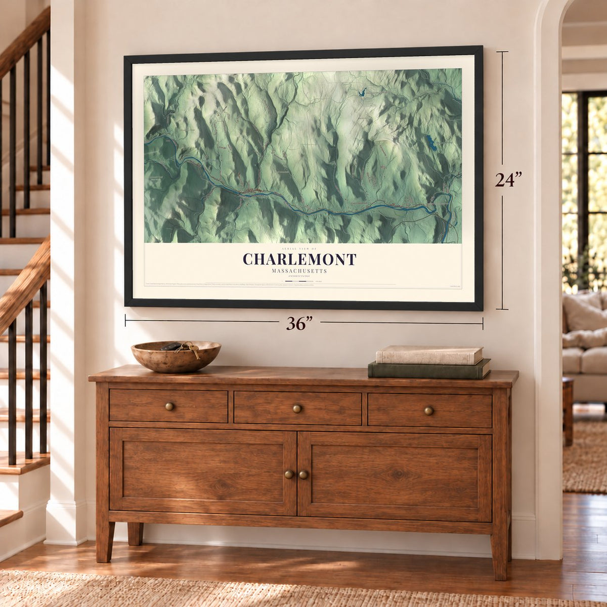 Charlemont, Massachusetts map, 24 x 36 inch print in a black frame above a dresser by a staircase
