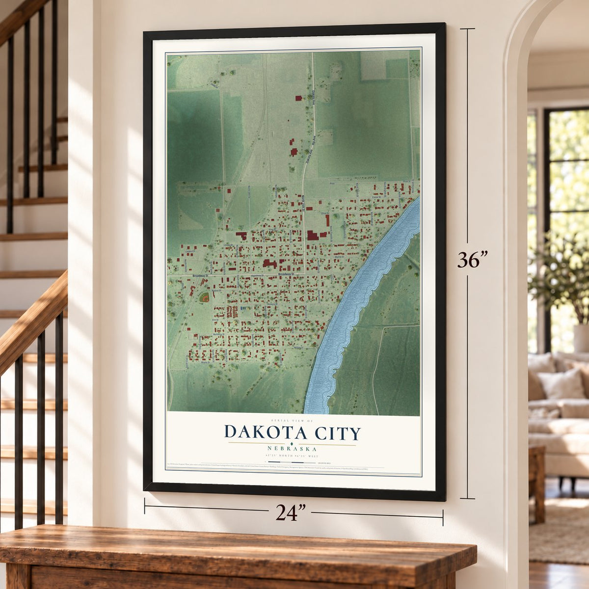 Dakota City, Nebraska map, 24 x 36 inch print in a black frame by a staircase