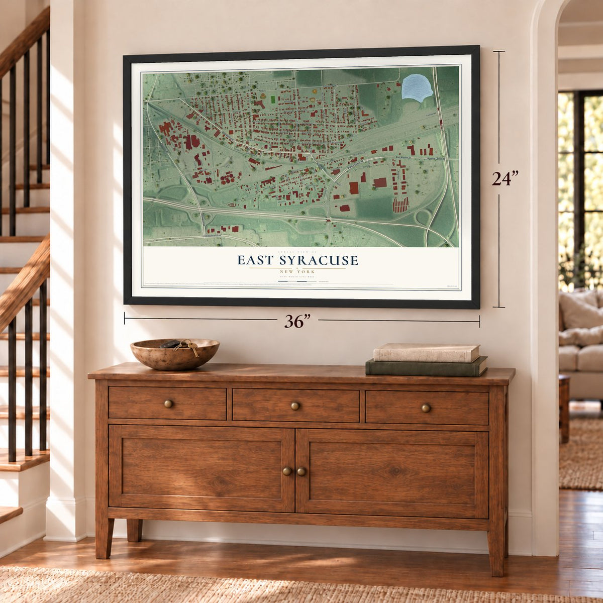 East Syracuse, New York map, 24 x 36 inch print in a black frame above a dresser by a staircase