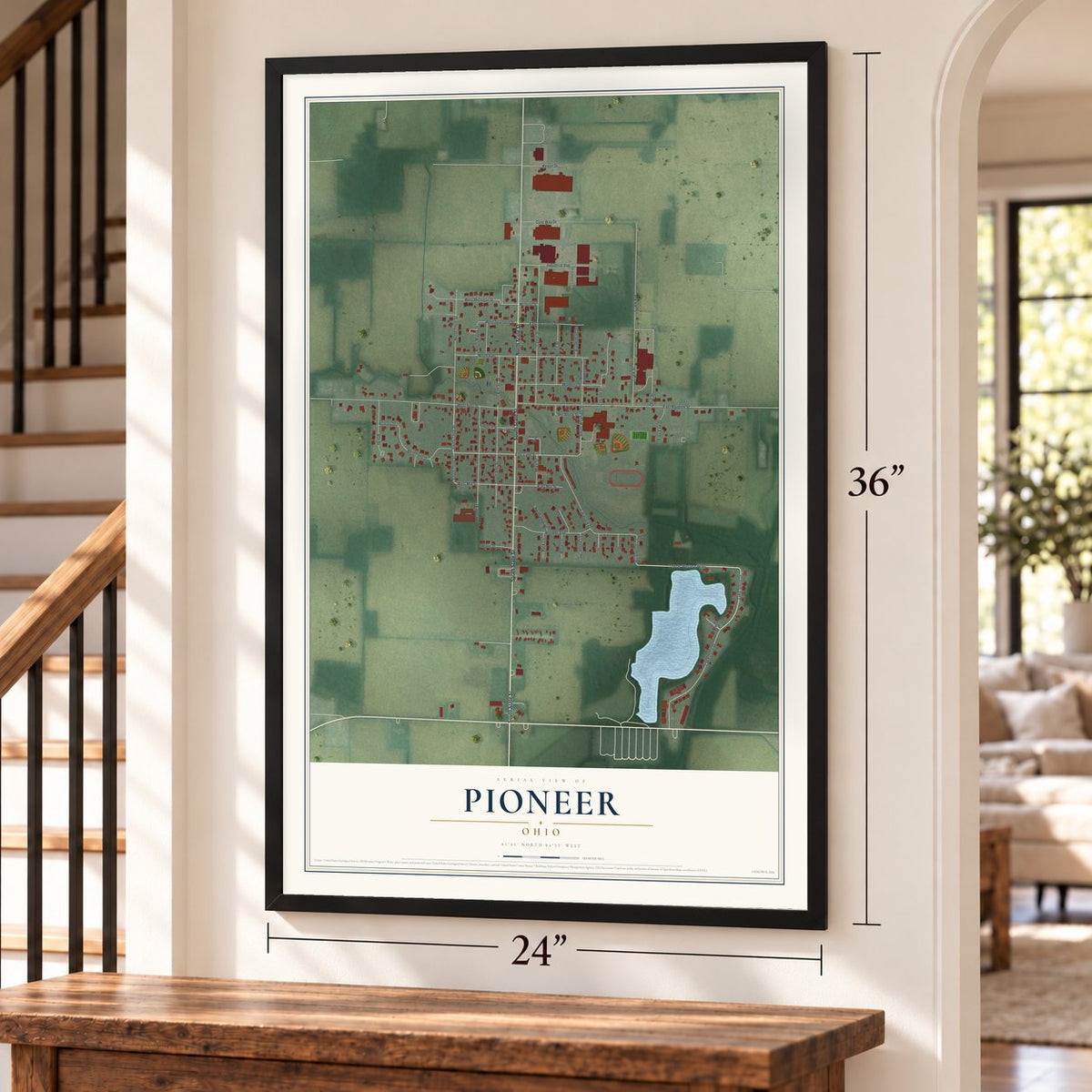 Pioneer, Ohio map, 24 x 36 inch print in a black frame by a staircase