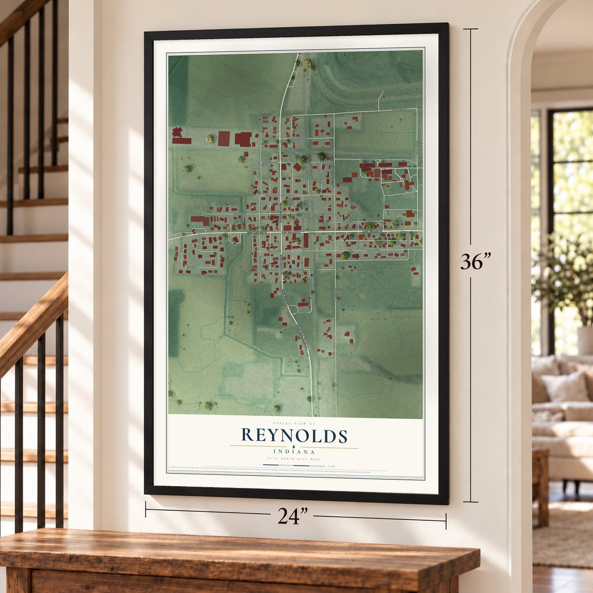 Reynolds, Indiana map, 24 x 36 inch print in a black frame by a staircase