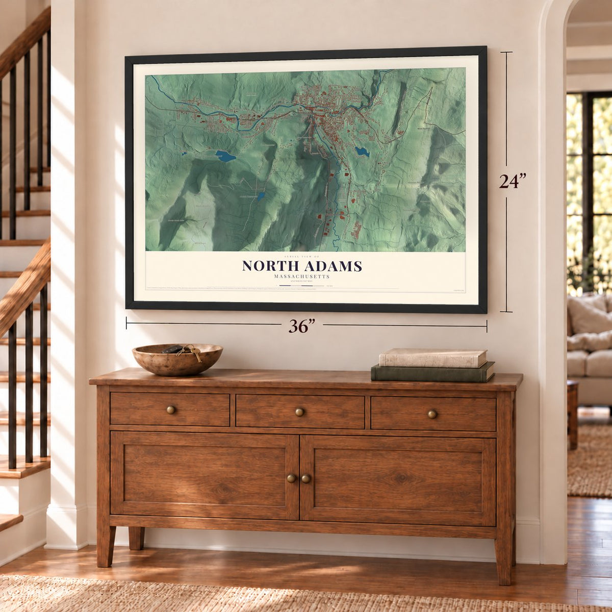 North Adams, Massachusetts map, 24 x 36 inch print in a black frame above a dresser by a staircase