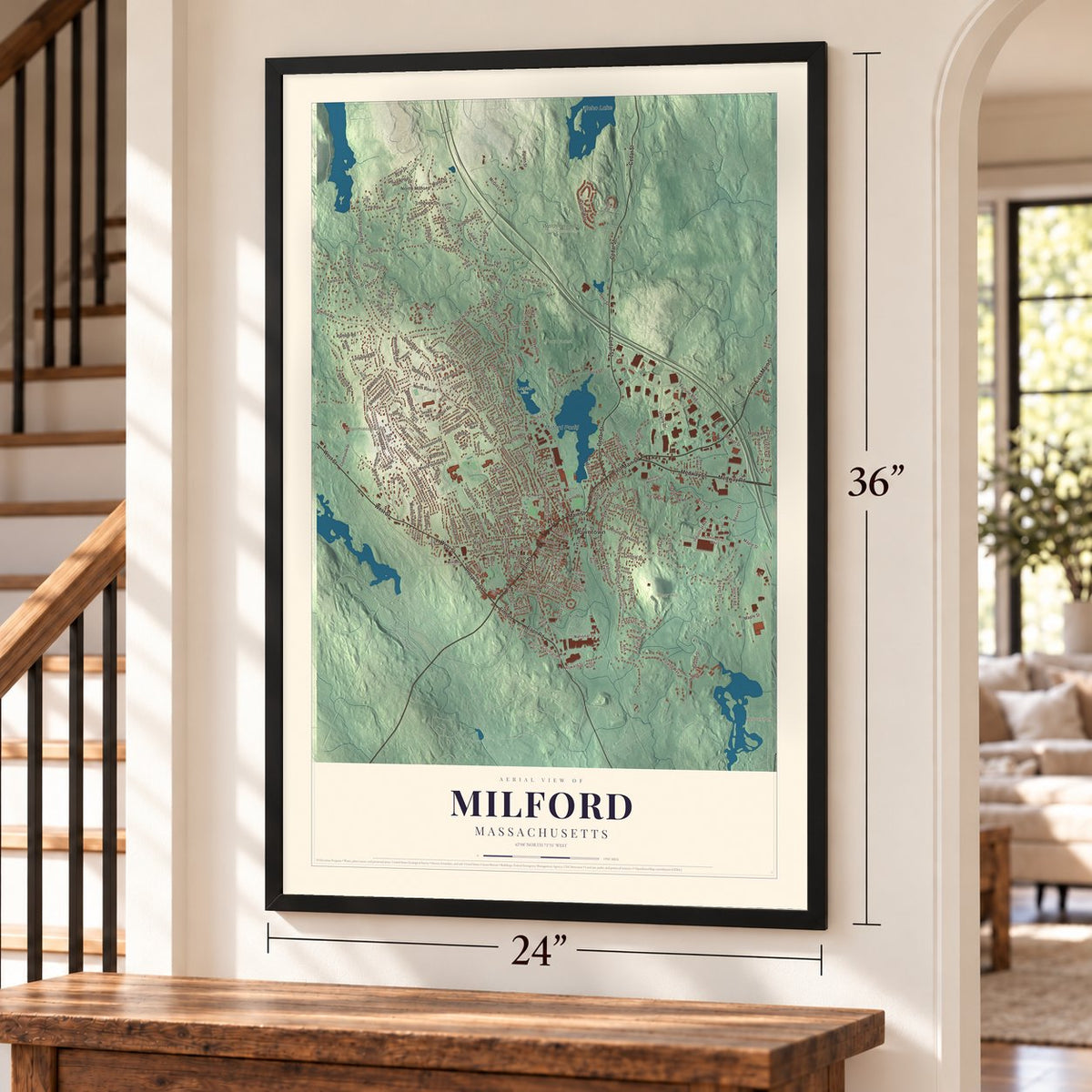 Milford, Massachusetts map, 24 x 36 inch print in a black frame by a staircase