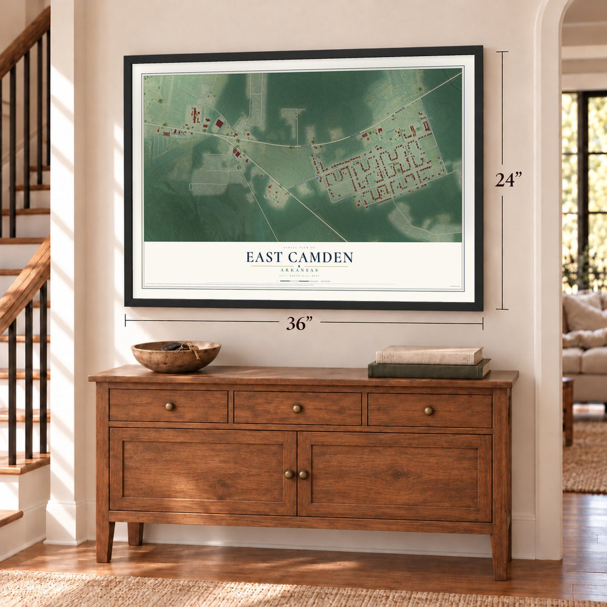 East Camden, Arkansas map, 24 x 36 inch print in a black frame above a dresser by a staircase