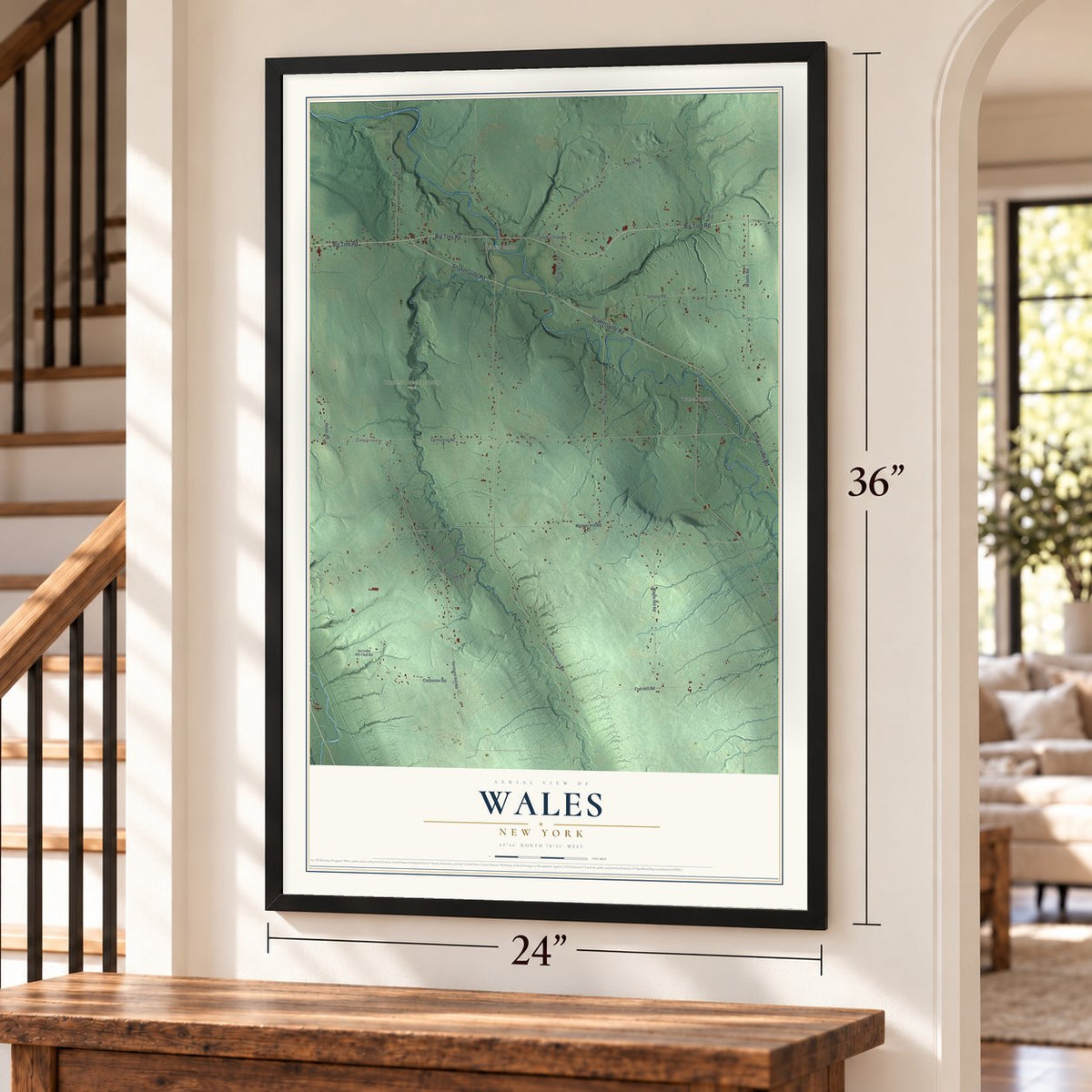 Wales, New York map, 24 x 36 inch print in a black frame by a staircase