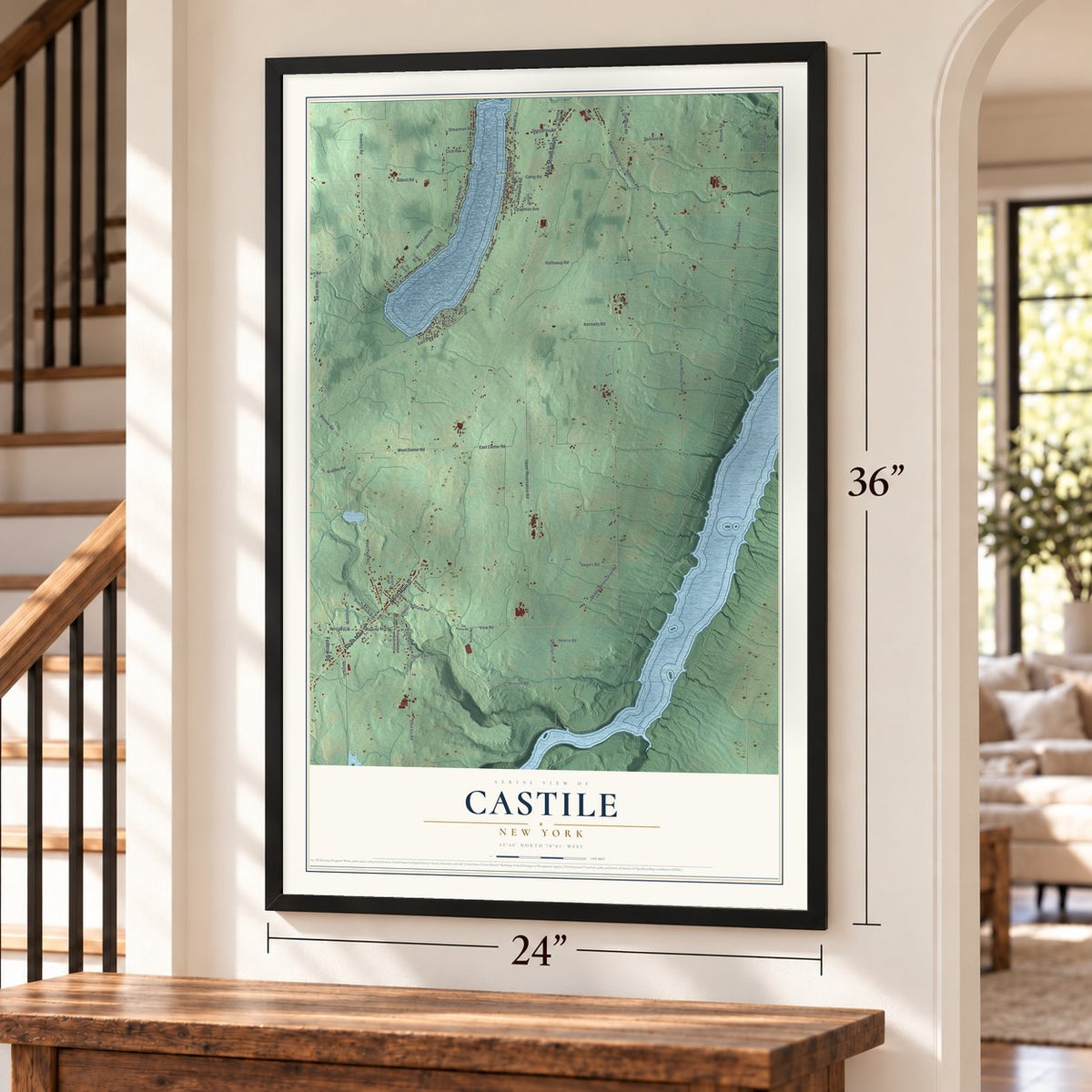 Castile, New York map, 24 x 36 inch print in a black frame by a staircase
