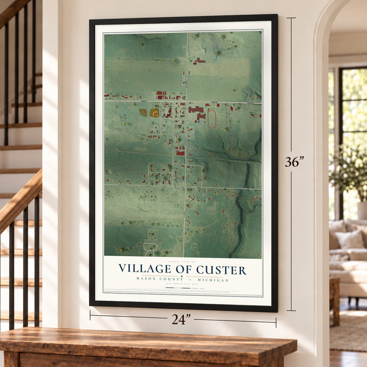 Custer, Michigan map, 24 x 36 inch print in a black frame by a staircase