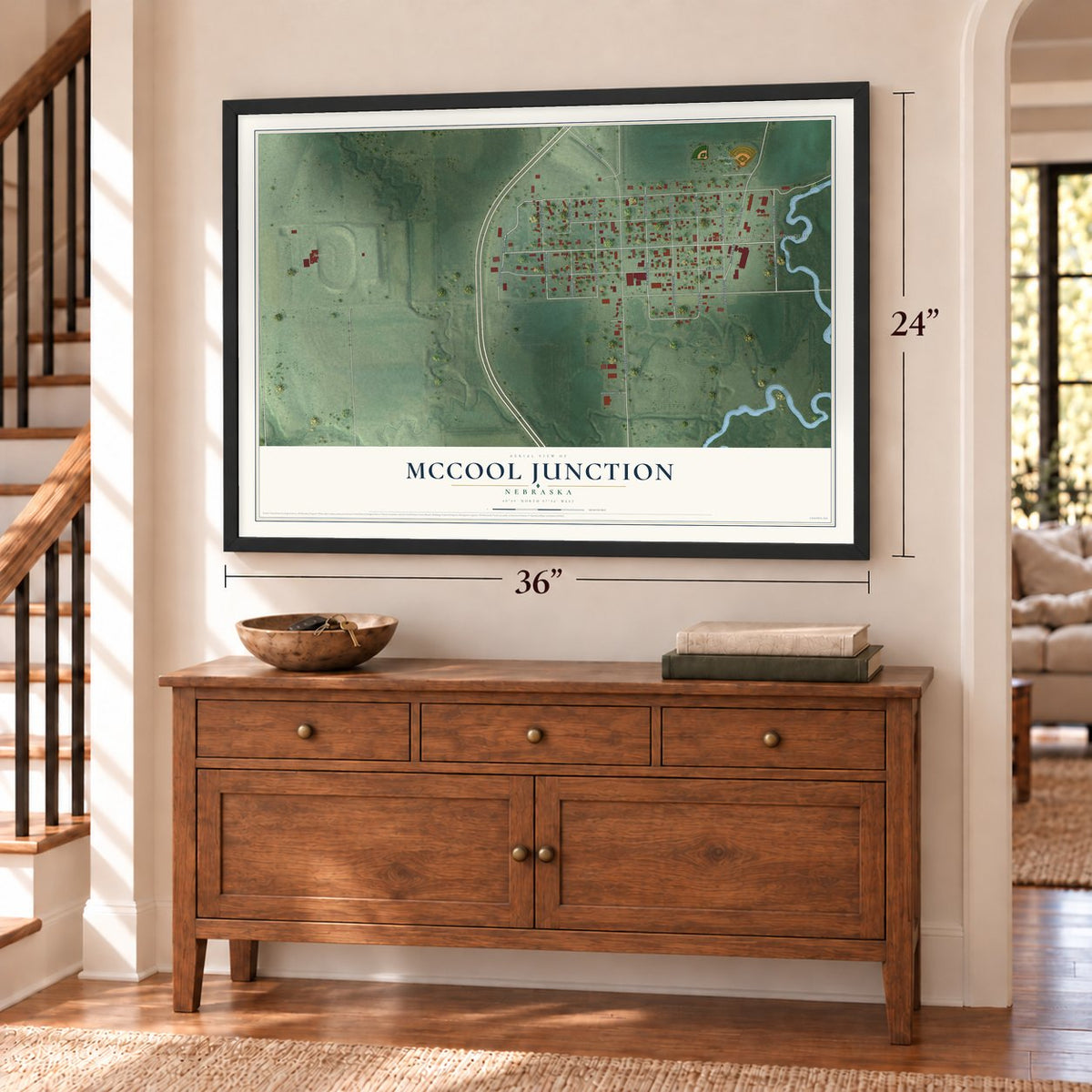 McCool Junction, Nebraska map, 24 x 36 inch print in a black frame above a dresser by a staircase