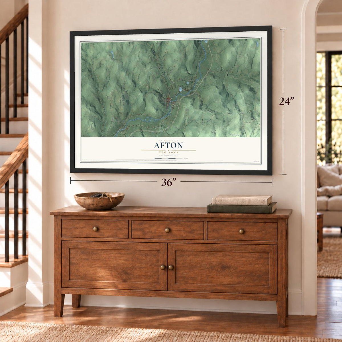 Afton, New York map, 24 x 36 inch print in a black frame above a dresser by a staircase