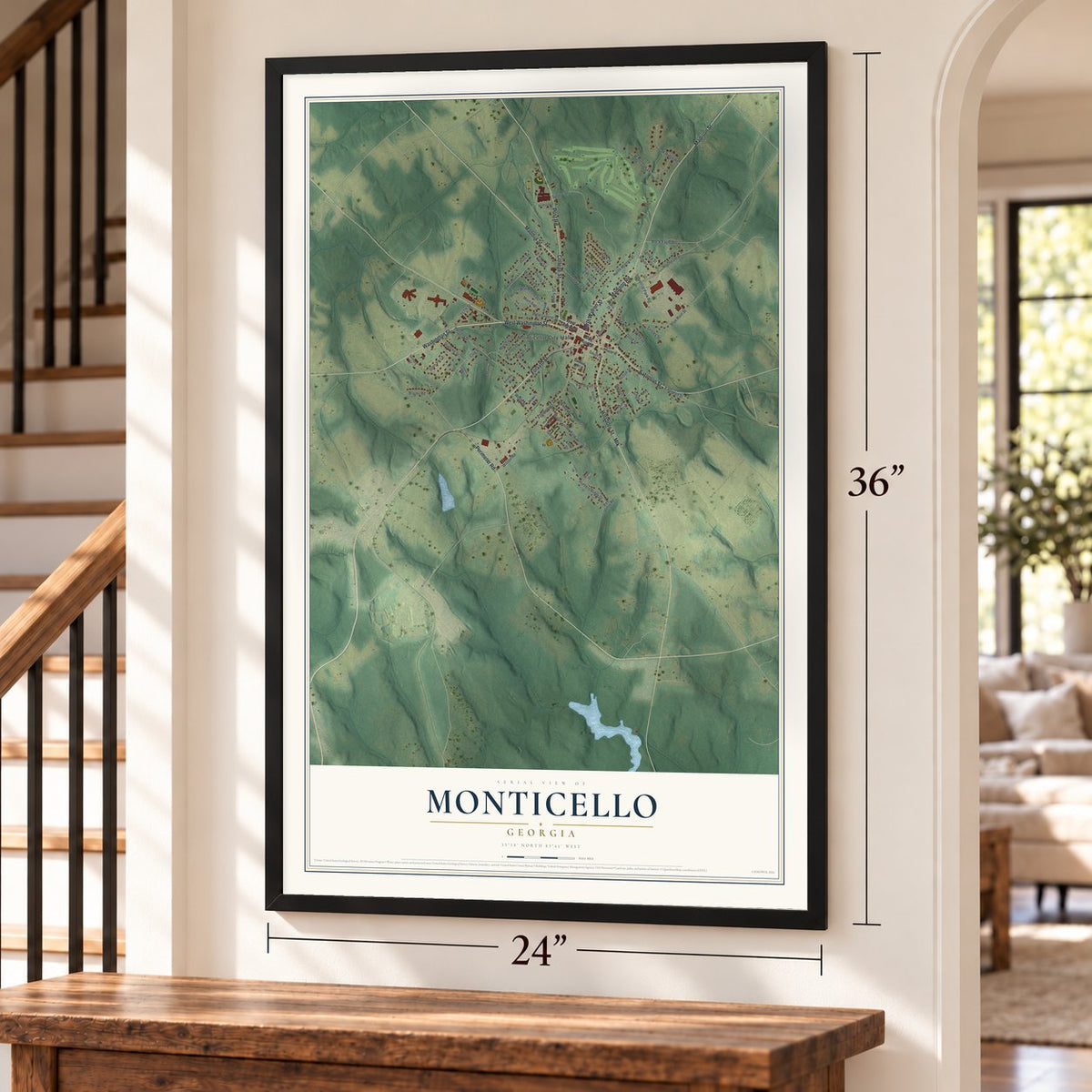 Monticello, Georgia map, 24 x 36 inch print in a black frame by a staircase