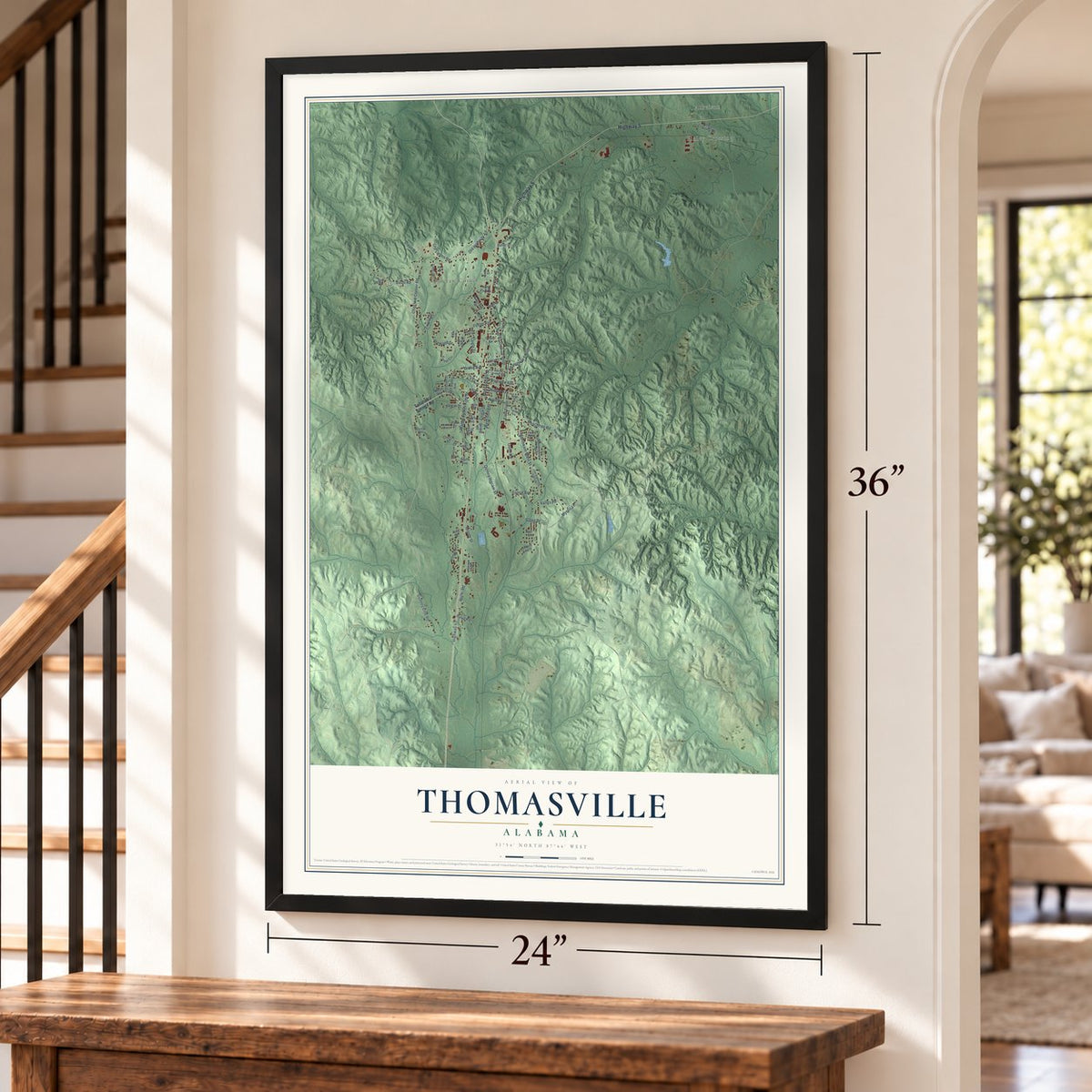 Thomasville, Alabama map, 24 x 36 inch print in a black frame by a staircase