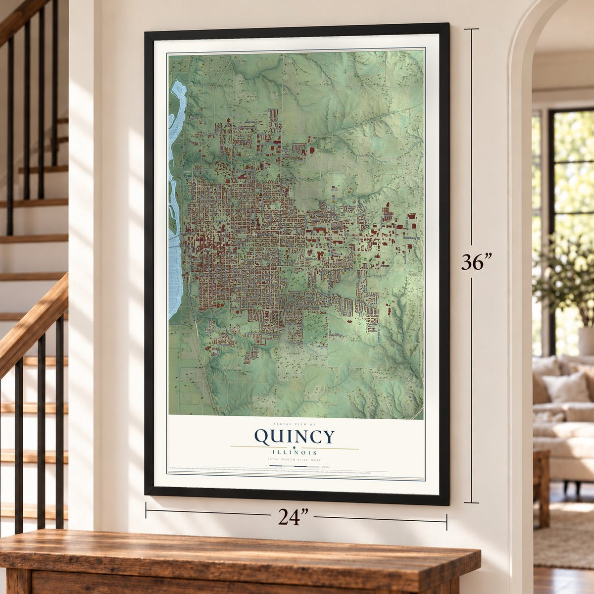 Quincy, Illinois map, 24 x 36 inch print in a black frame by a staircase