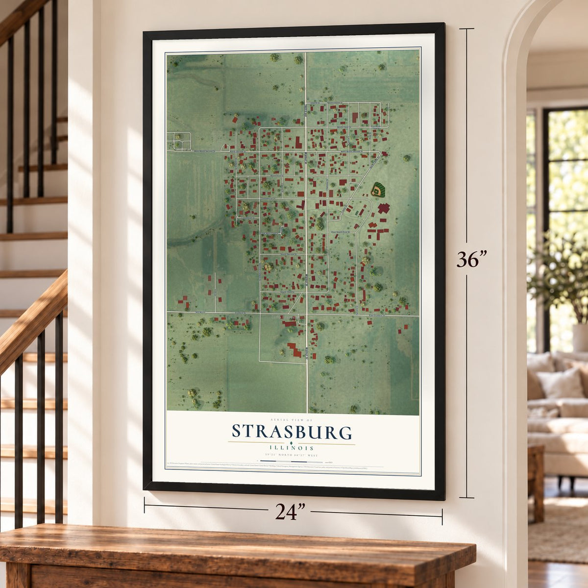 Strasburg, Illinois map, 24 x 36 inch print in a black frame by a staircase