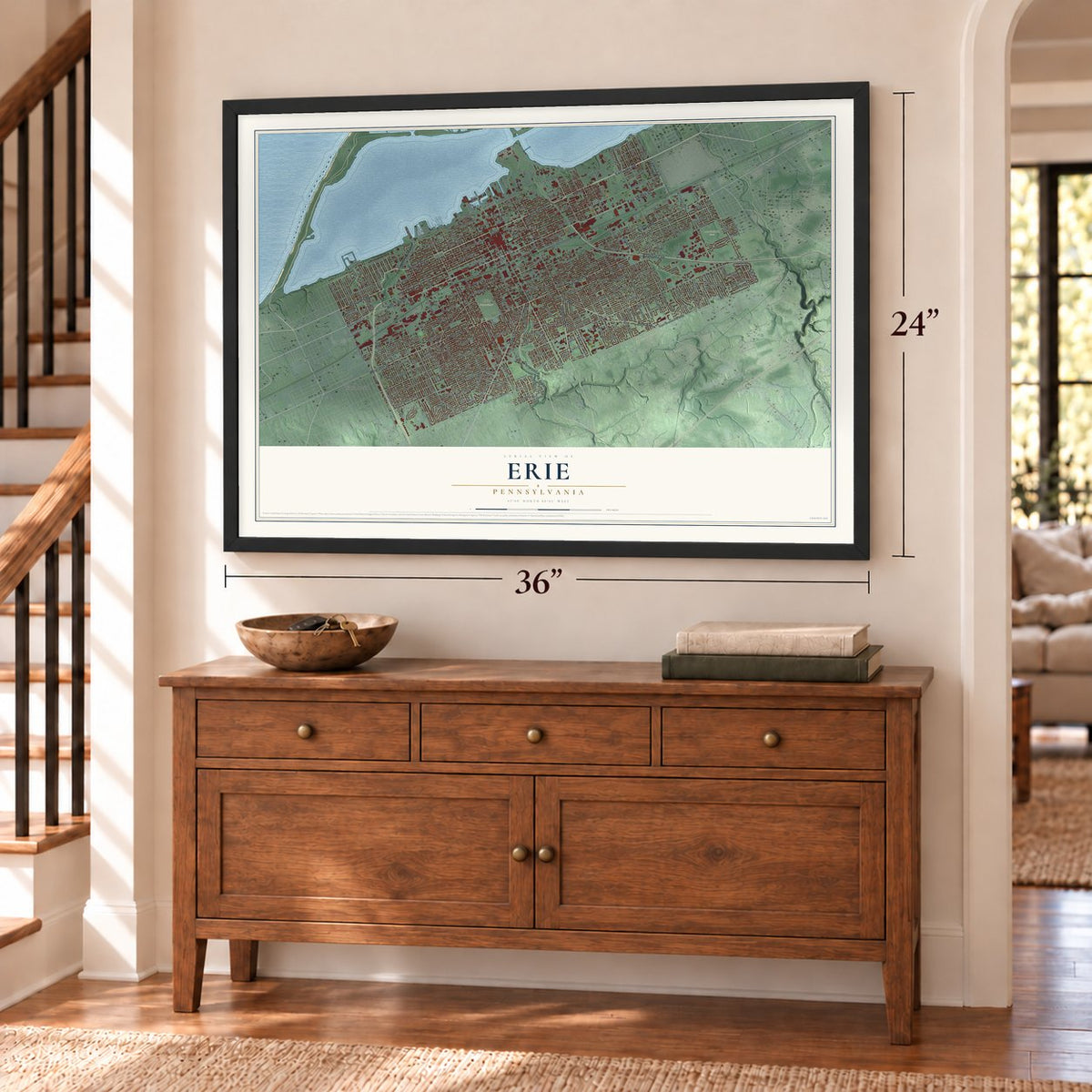 Erie, Pennsylvania map, 24 x 36 inch print in a black frame above a dresser by a staircase