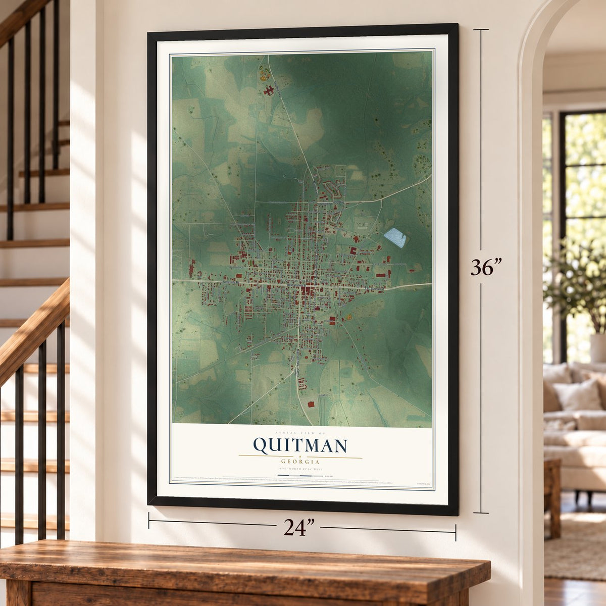 Quitman, Georgia map, 24 x 36 inch print in a black frame by a staircase