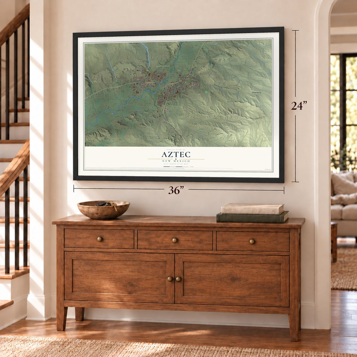 Aztec, New Mexico map, 24 x 36 inch print in a black frame above a dresser by a staircase