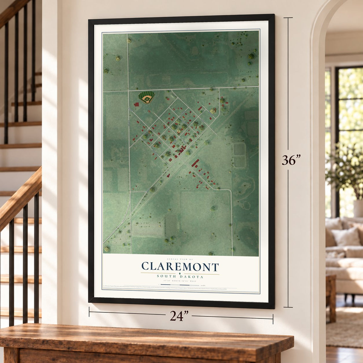 Claremont, South Dakota map, 24 x 36 inch print in a black frame by a staircase