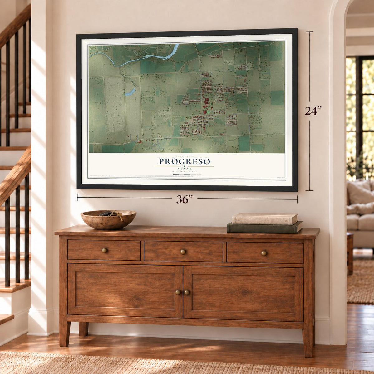 Progreso, Texas map, 24 x 36 inch print in a black frame above a dresser by a staircase