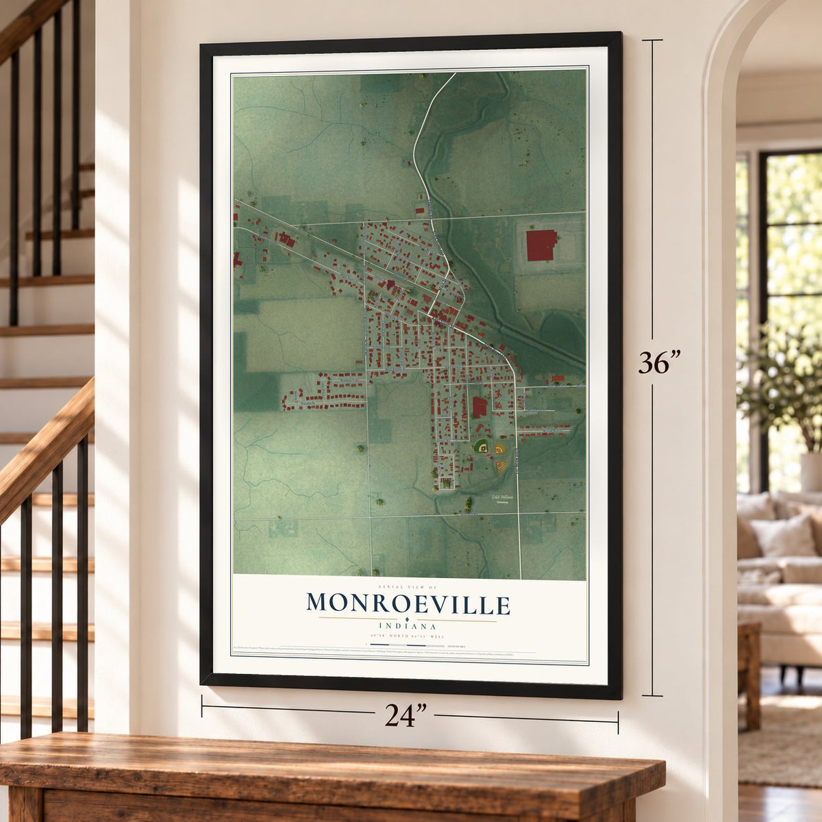 Monroeville, Indiana map, 24 x 36 inch print in a black frame by a staircase