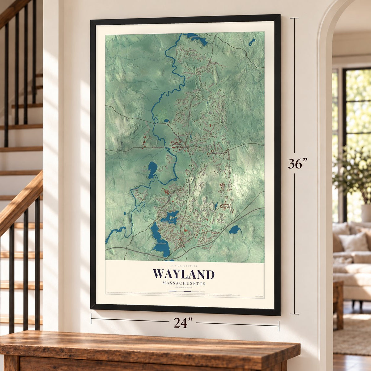Wayland, Massachusetts map, 24 x 36 inch print in a black frame by a staircase