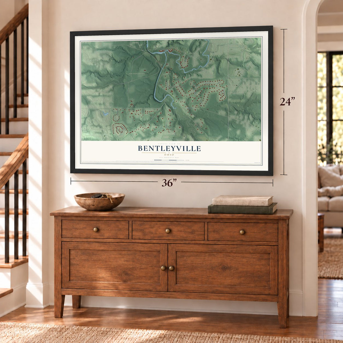 Bentleyville, Ohio map, 24 x 36 inch print in a black frame above a dresser by a staircase