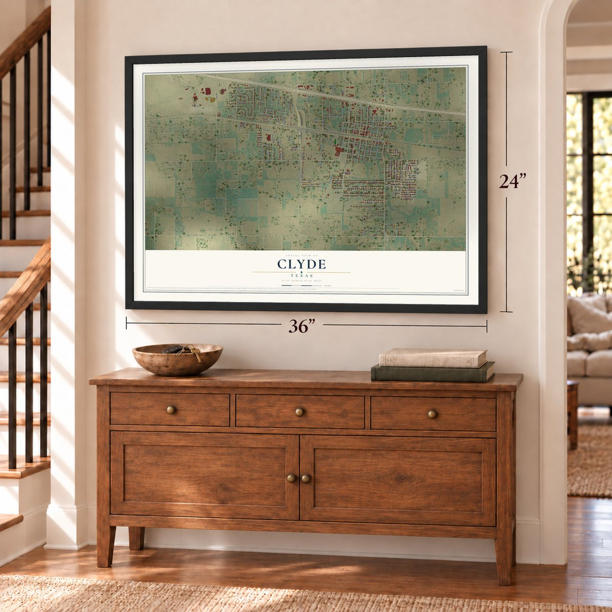 Clyde, Texas map, 24 x 36 inch print in a black frame above a dresser by a staircase