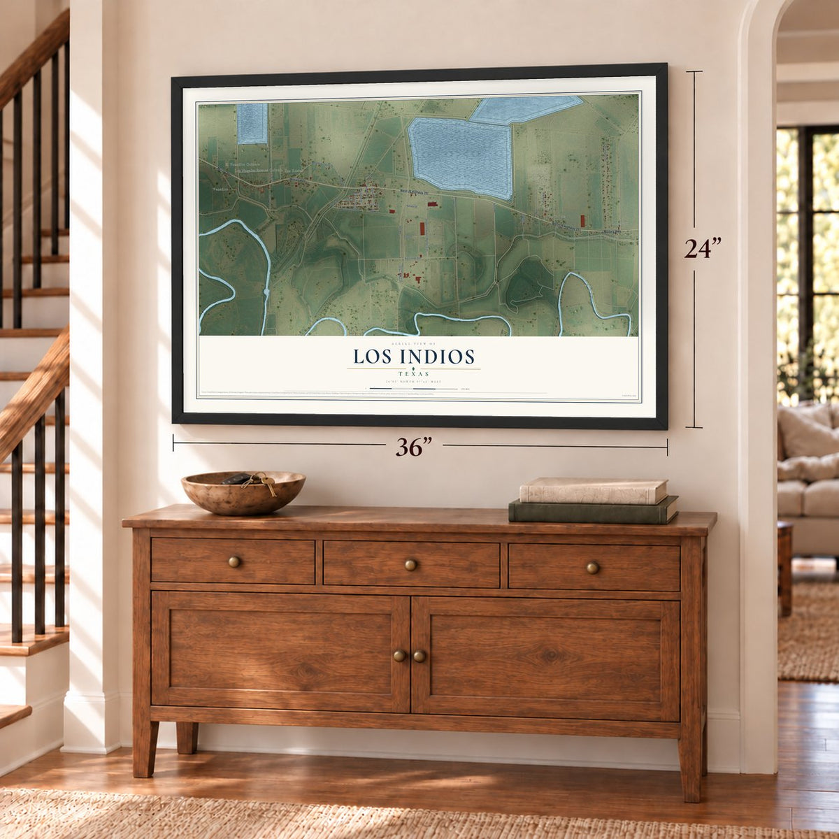 Los Indios, Texas map, 24 x 36 inch print in a black frame above a dresser by a staircase