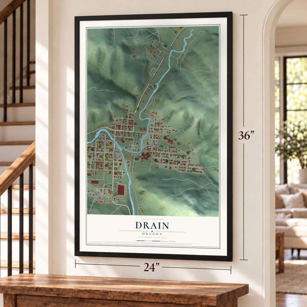Drain, Oregon map, 24 x 36 inch print in a black frame by a staircase