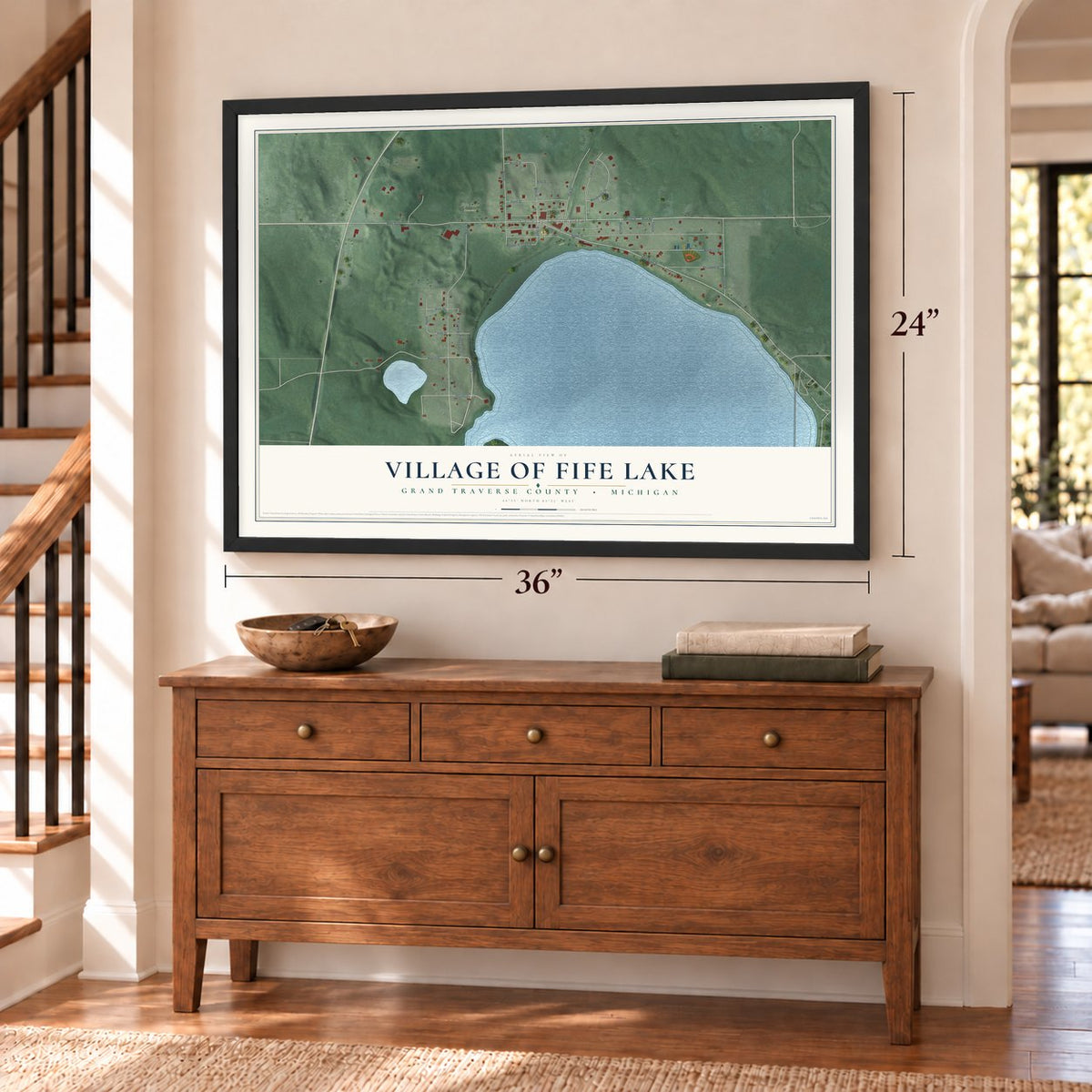 Fife Lake, Michigan map, 24 x 36 inch print in a black frame above a dresser by a staircase