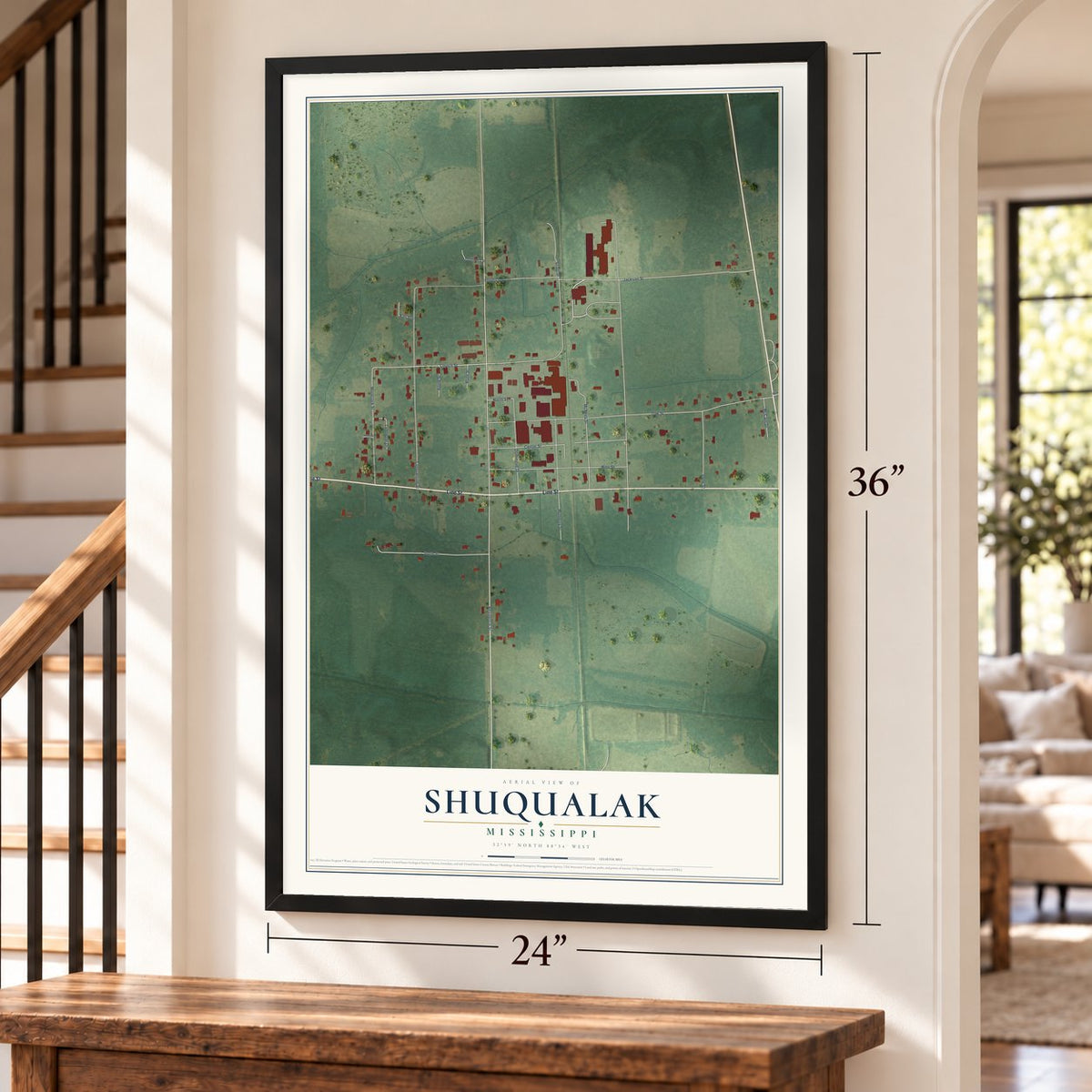 Shuqualak, Mississippi map, 24 x 36 inch print in a black frame by a staircase