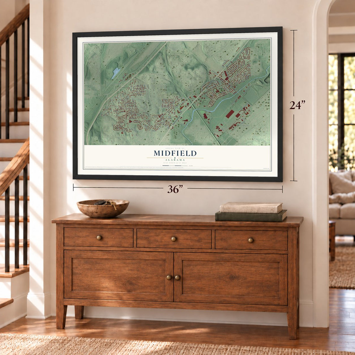 Midfield, Alabama map, 24 x 36 inch print in a black frame above a dresser by a staircase