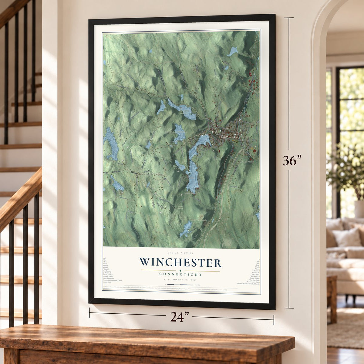 Winchester, Connecticut map, 24 x 36 inch print in a black frame by a staircase