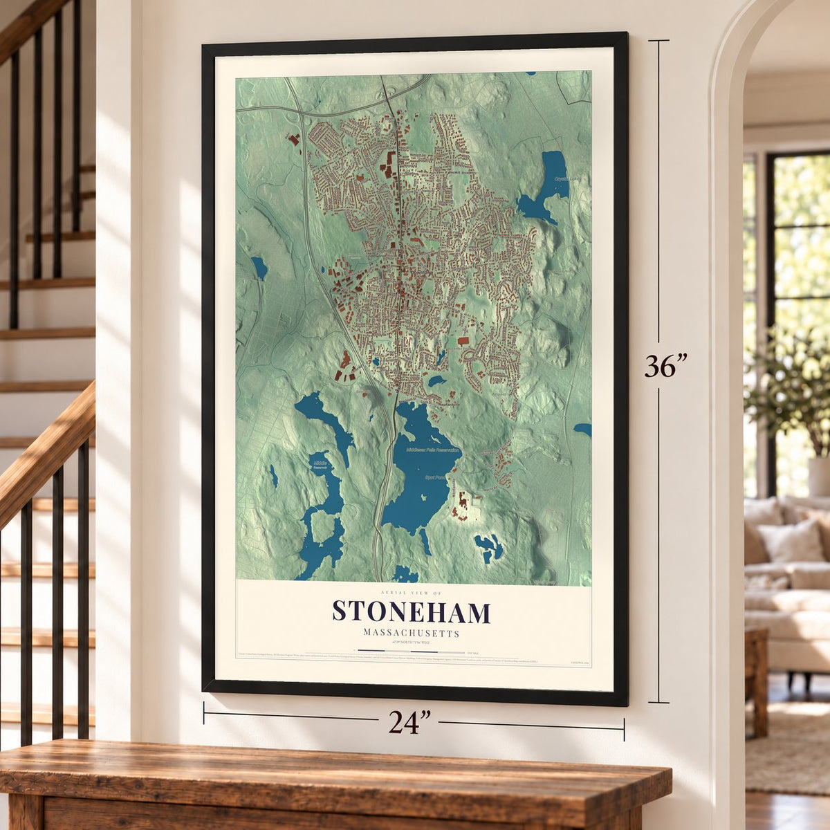 Stoneham, Massachusetts map, 24 x 36 inch print in a black frame by a staircase