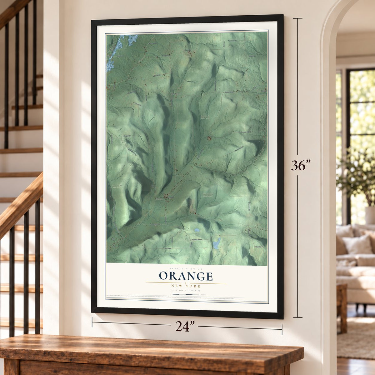 Orange, New York map, 24 x 36 inch print in a black frame by a staircase