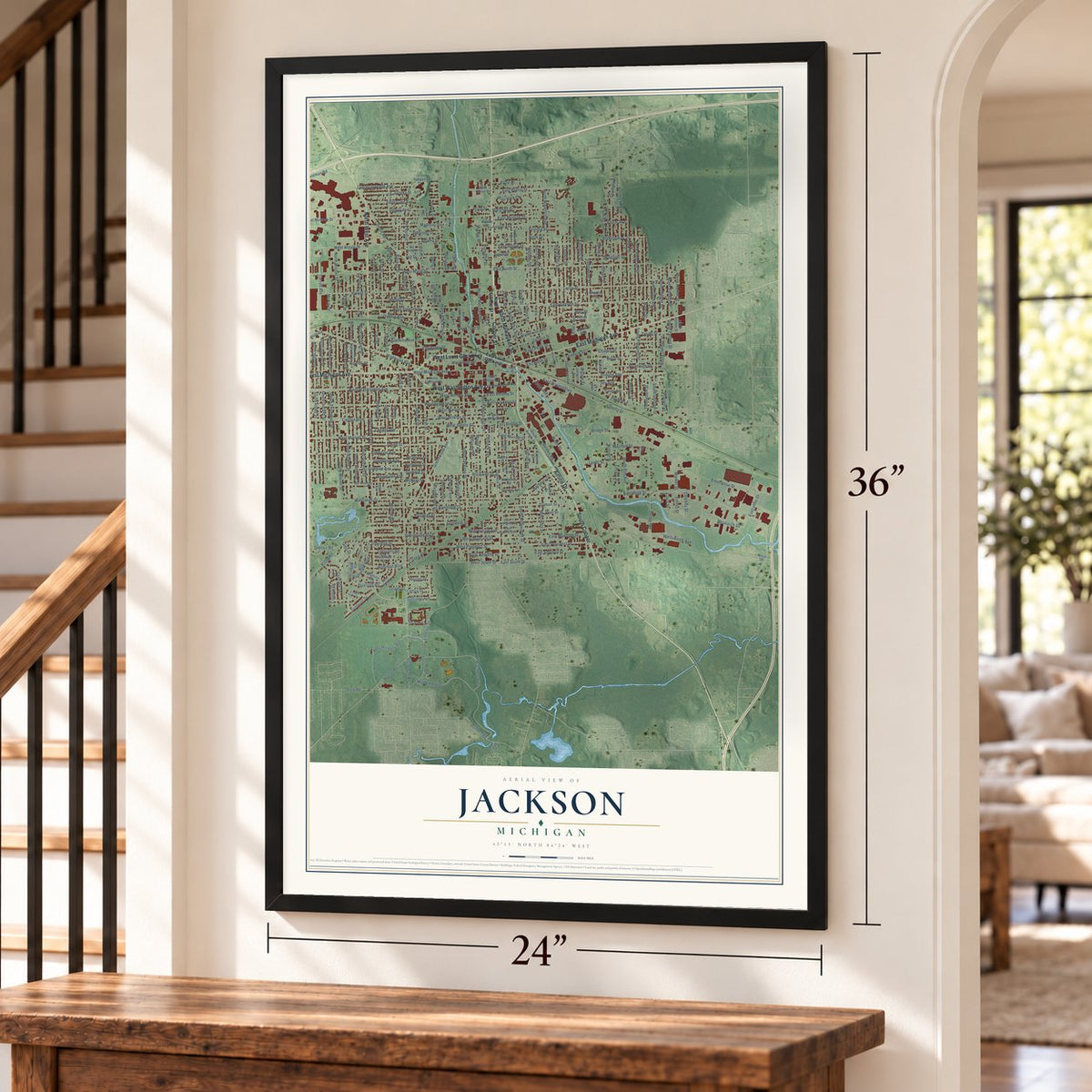 Jackson, Michigan map, 24 x 36 inch print in a black frame by a staircase
