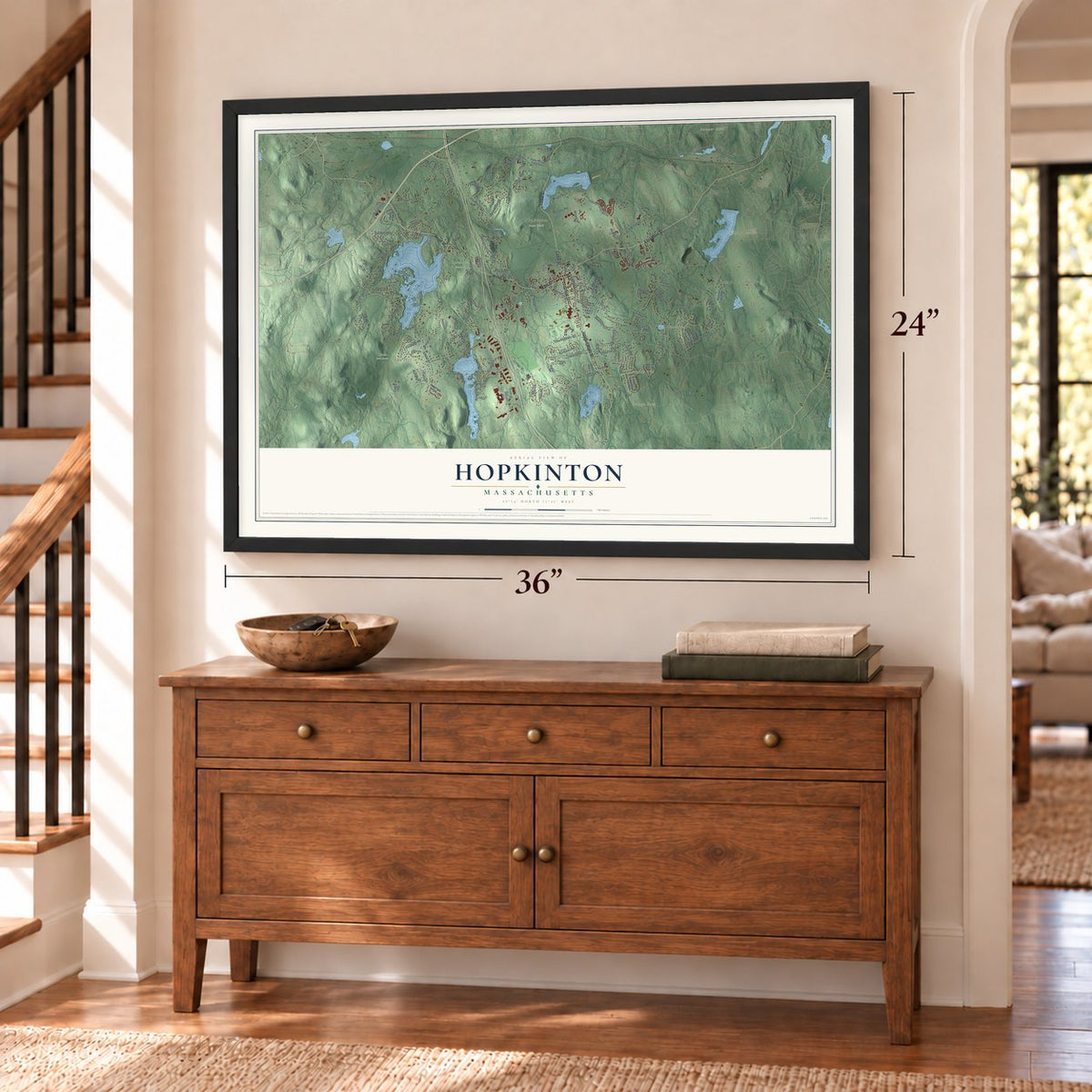 Hopkinton, Massachusetts map, 24 x 36 inch print in a black frame above a dresser by a staircase