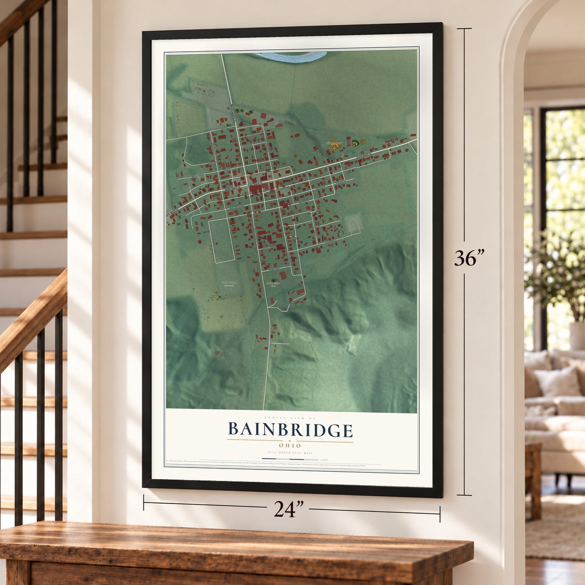 Bainbridge, Ohio map, 24 x 36 inch print in a black frame by a staircase