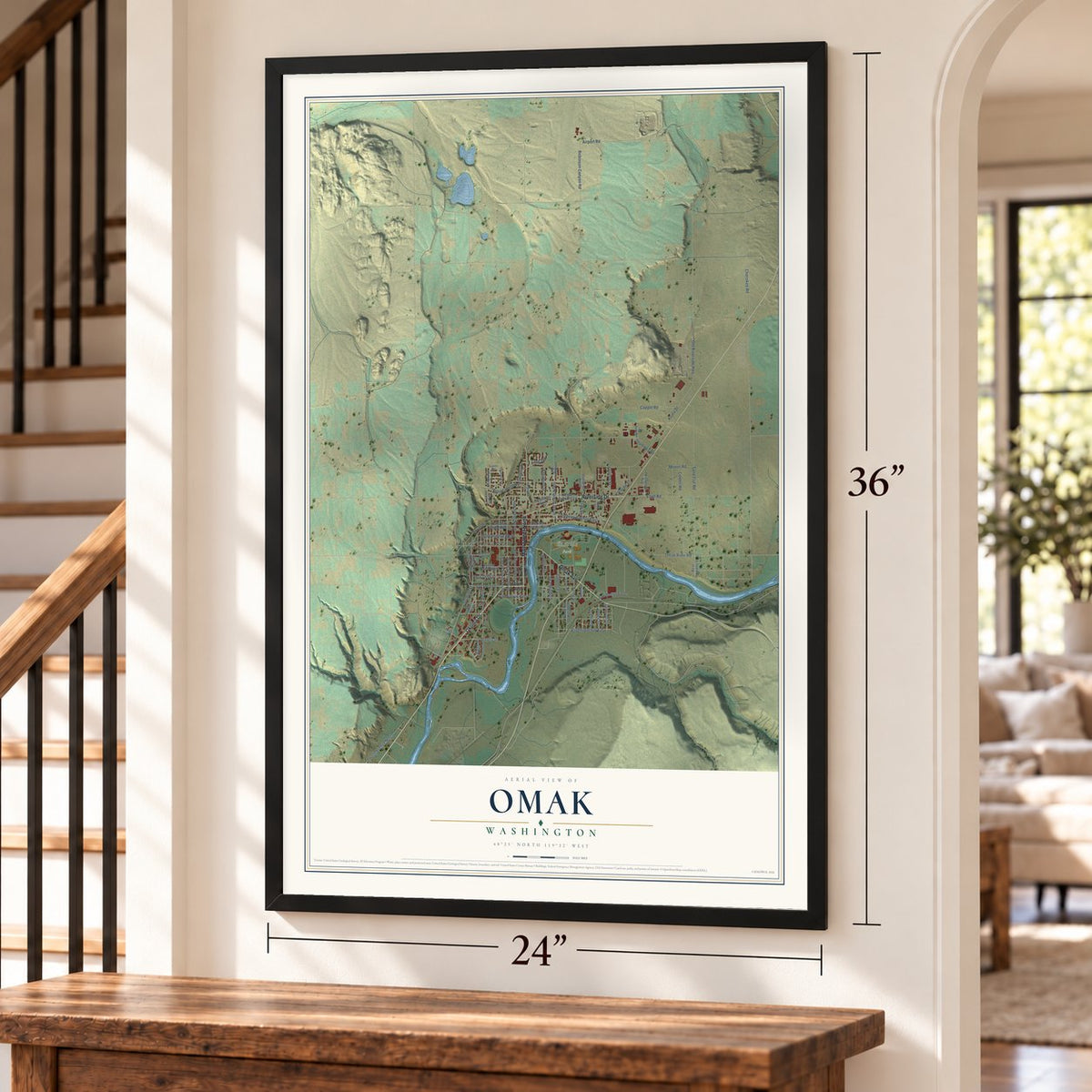 Omak, Washington map, 24 x 36 inch print in a black frame by a staircase