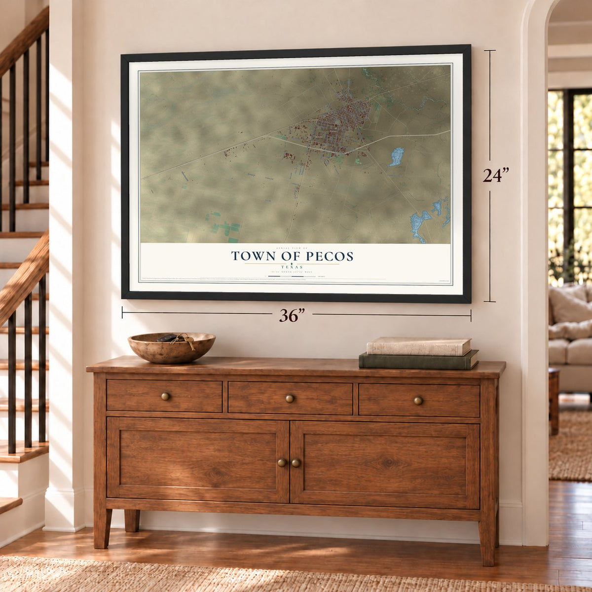 Town of Pecos, Texas map, 24 x 36 inch print in a black frame above a dresser by a staircase