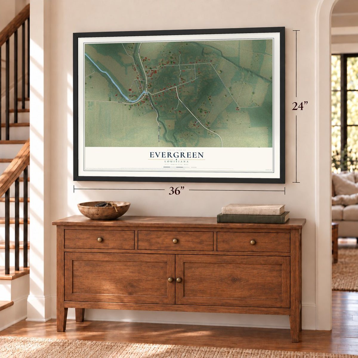 Evergreen, Louisiana map, 24 x 36 inch print in a black frame above a dresser by a staircase