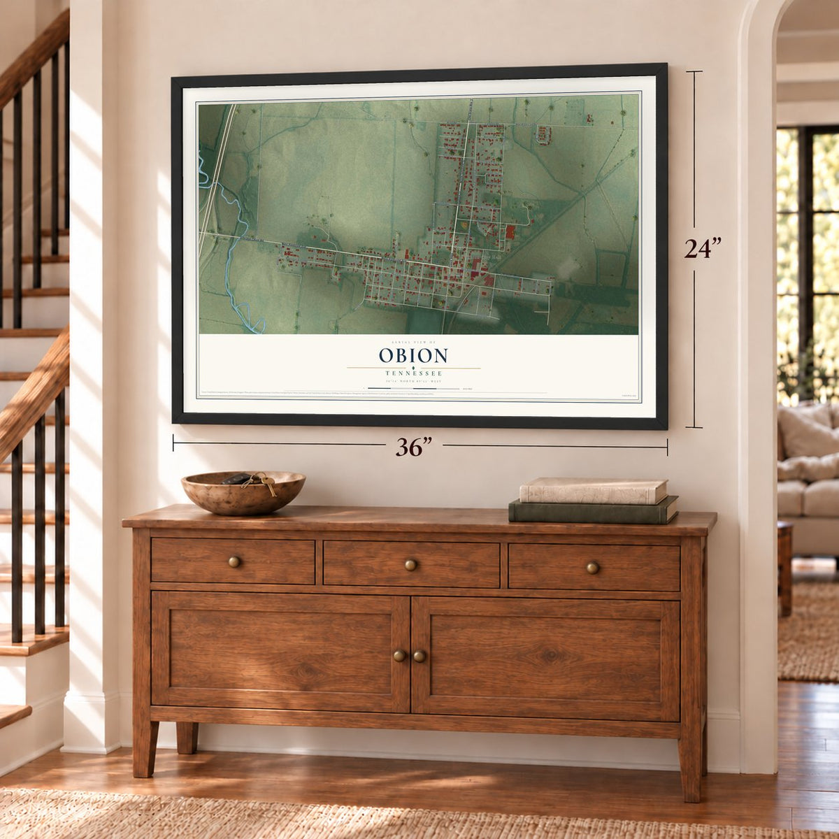 Obion, Tennessee map, 24 x 36 inch print in a black frame above a dresser by a staircase