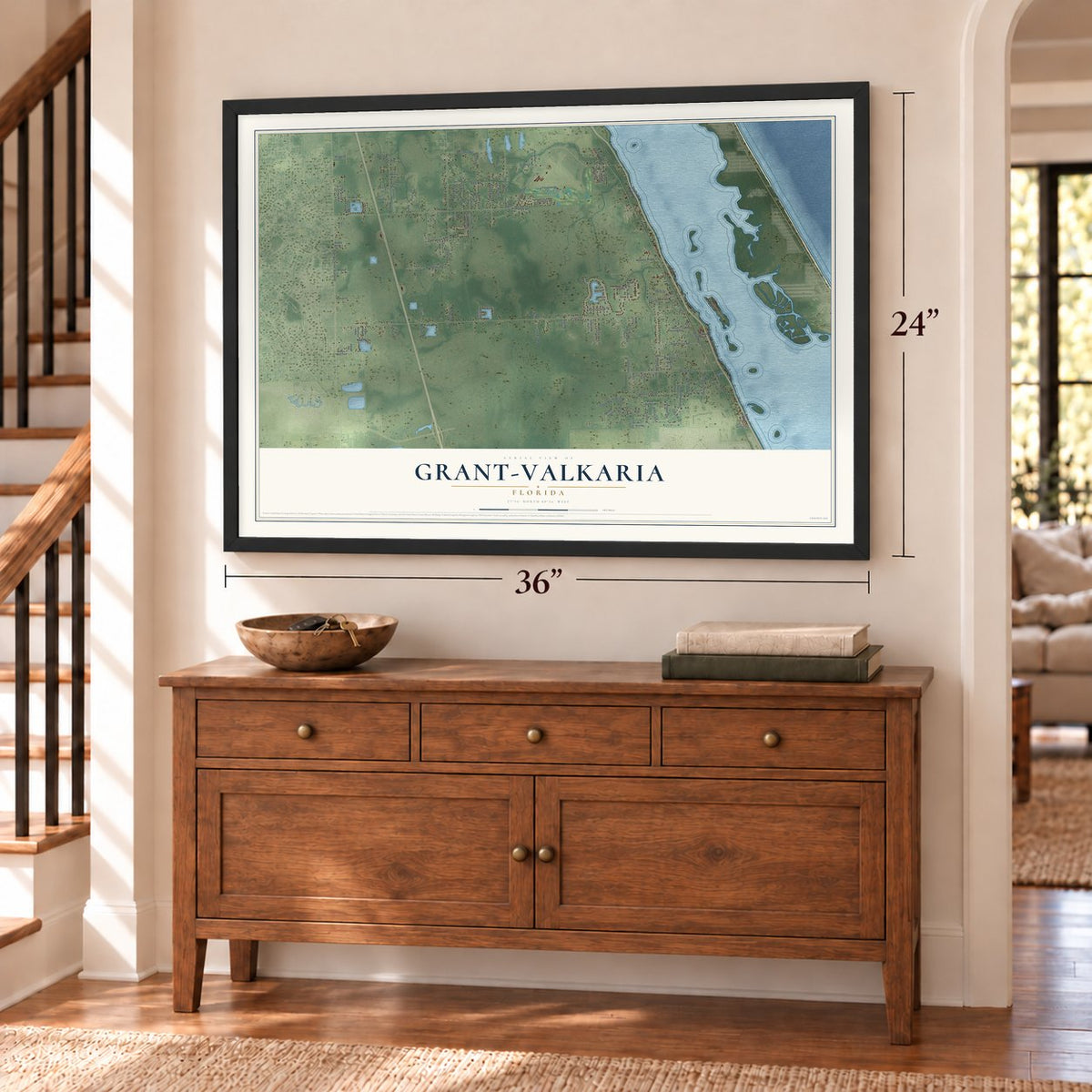 Grant-Valkaria, Florida map, 24 x 36 inch print in a black frame above a dresser by a staircase