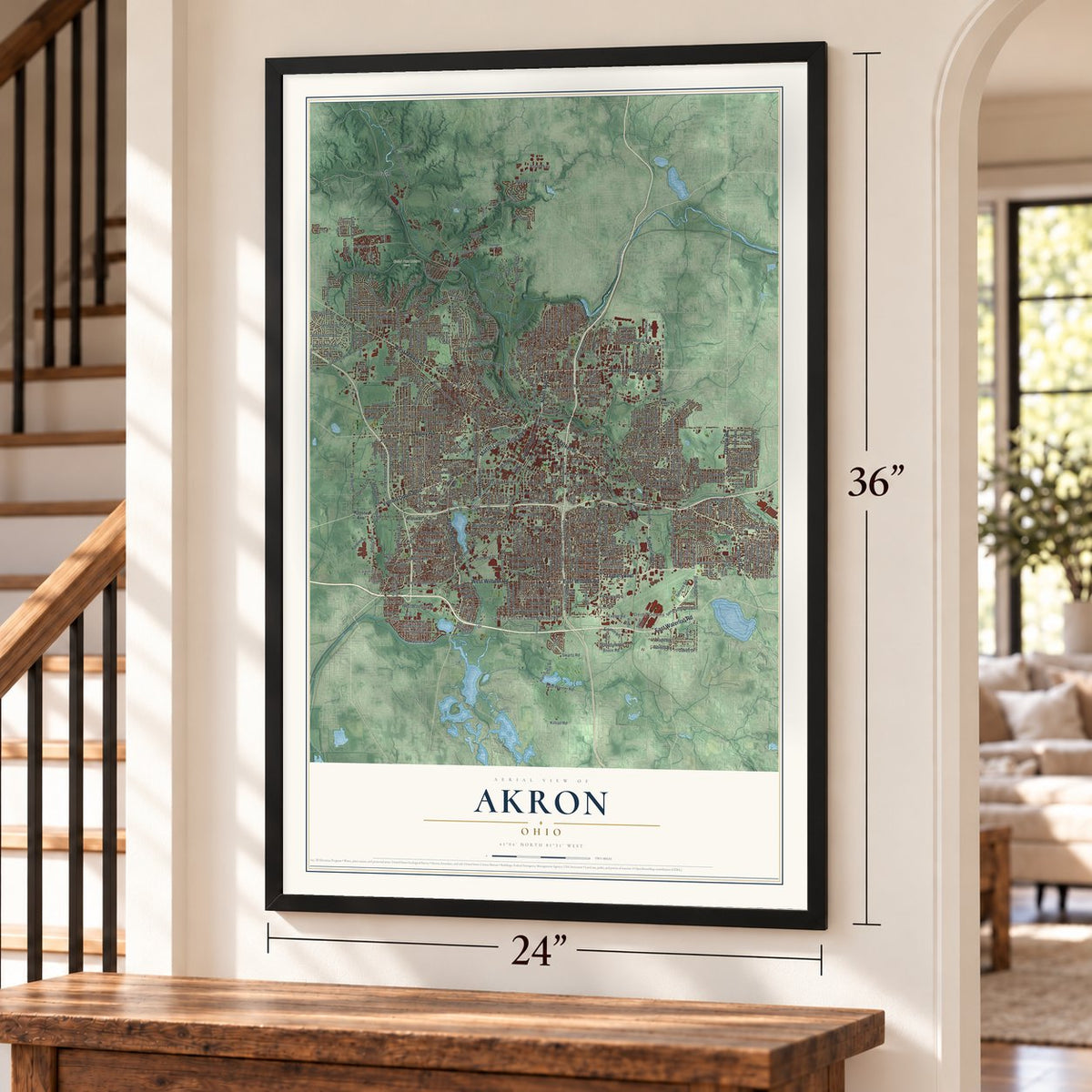 Akron, Ohio map, 24 x 36 inch print in a black frame by a staircase