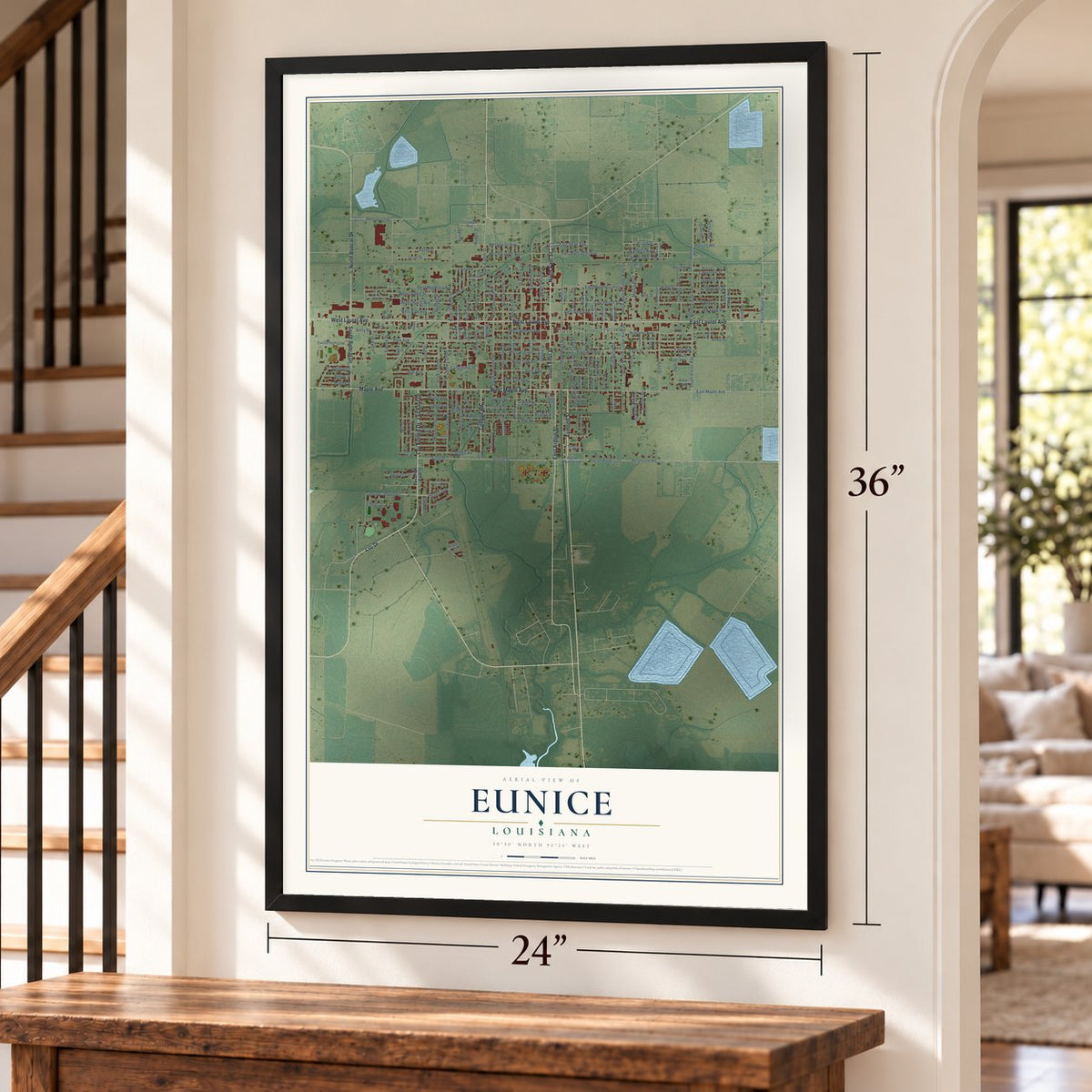 Eunice, Louisiana map, 24 x 36 inch print in a black frame by a staircase