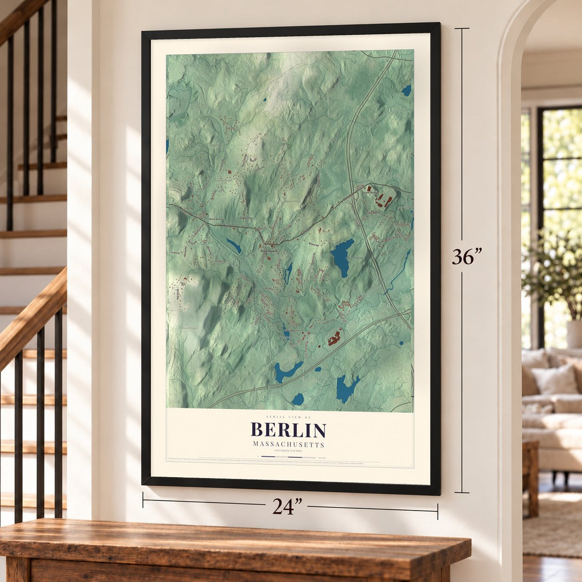 Berlin, Massachusetts map, 24 x 36 inch print in a black frame by a staircase
